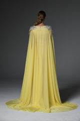 Yellow embroidered crêpe dress featuring chiffon cape