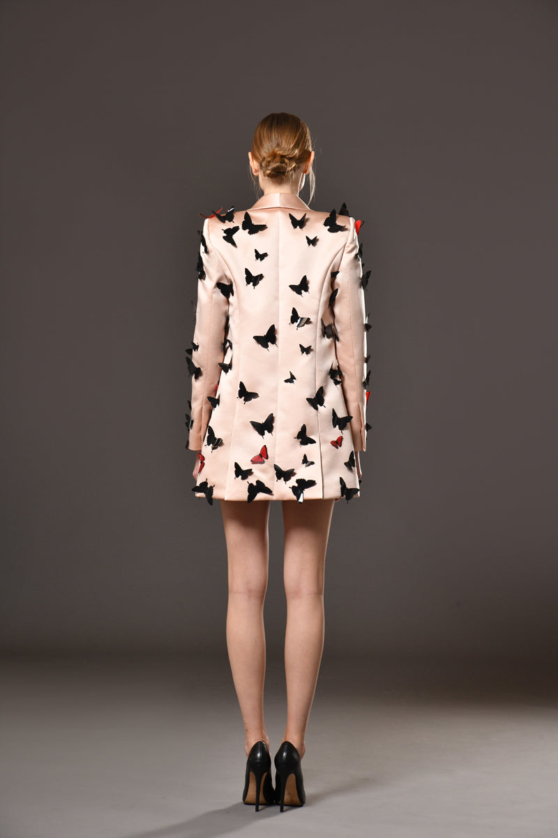 Hand stitched laser-cut butterflies on peach blazer