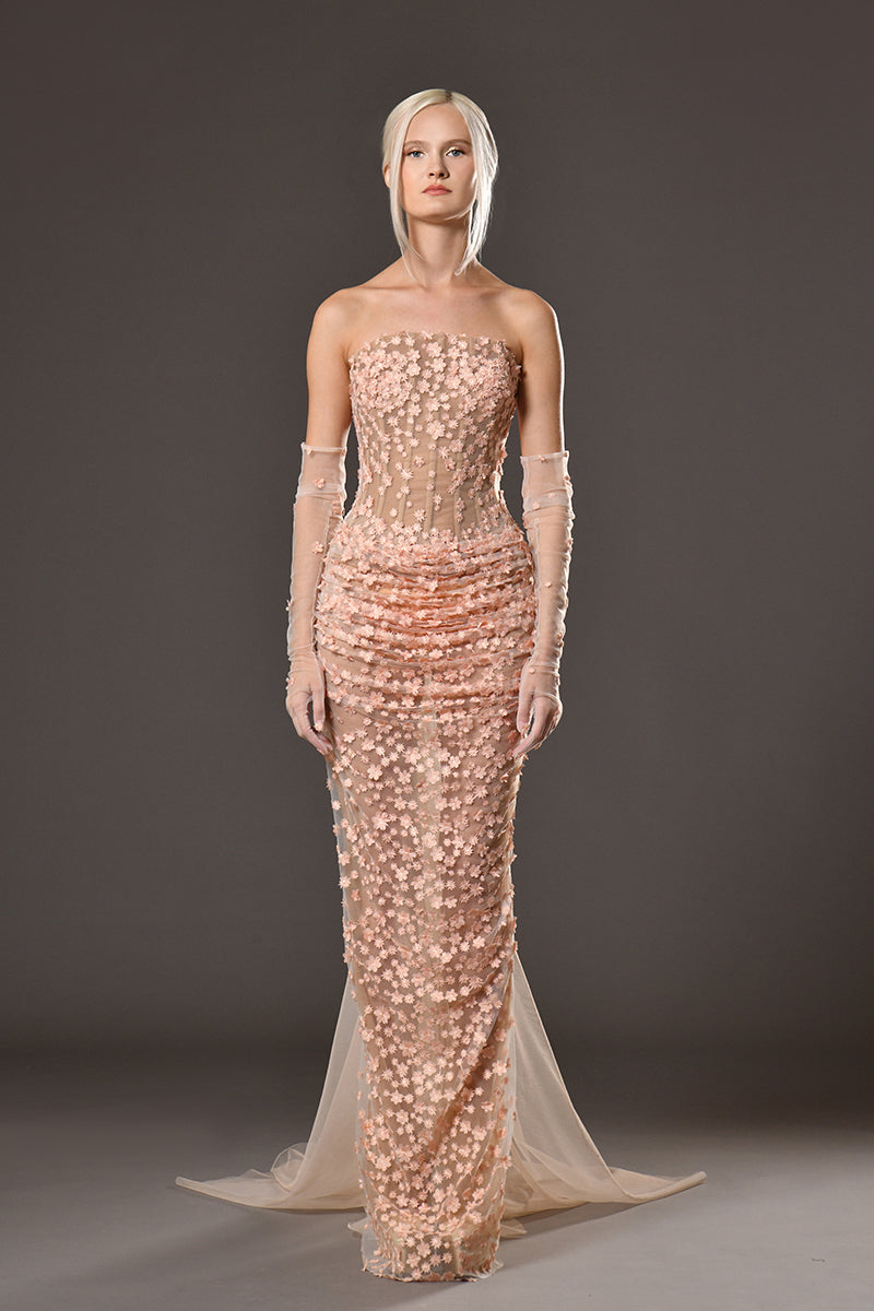 Strapless long corset dress fully adorned with mini flowers, gathered waistline, gloves and floor sweeping train