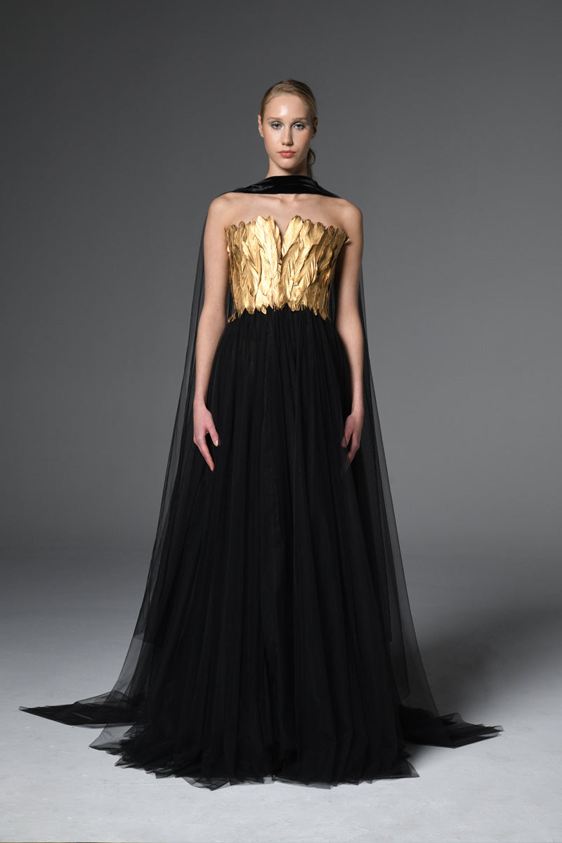 Corseted tulle dress adorned with gold feathers