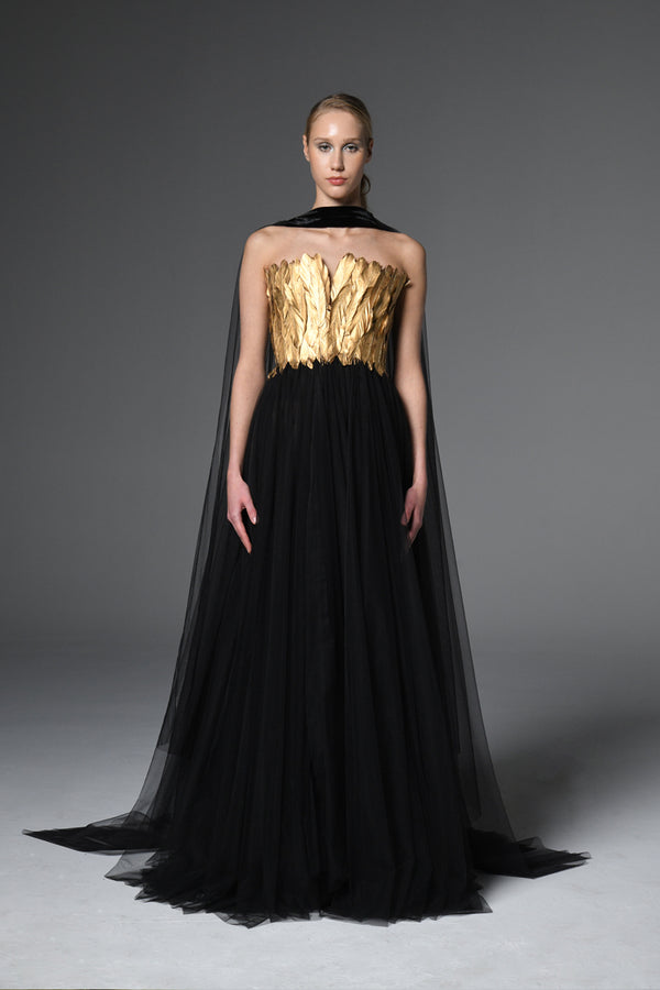 Corseted tulle long dress adorned with gold feathers