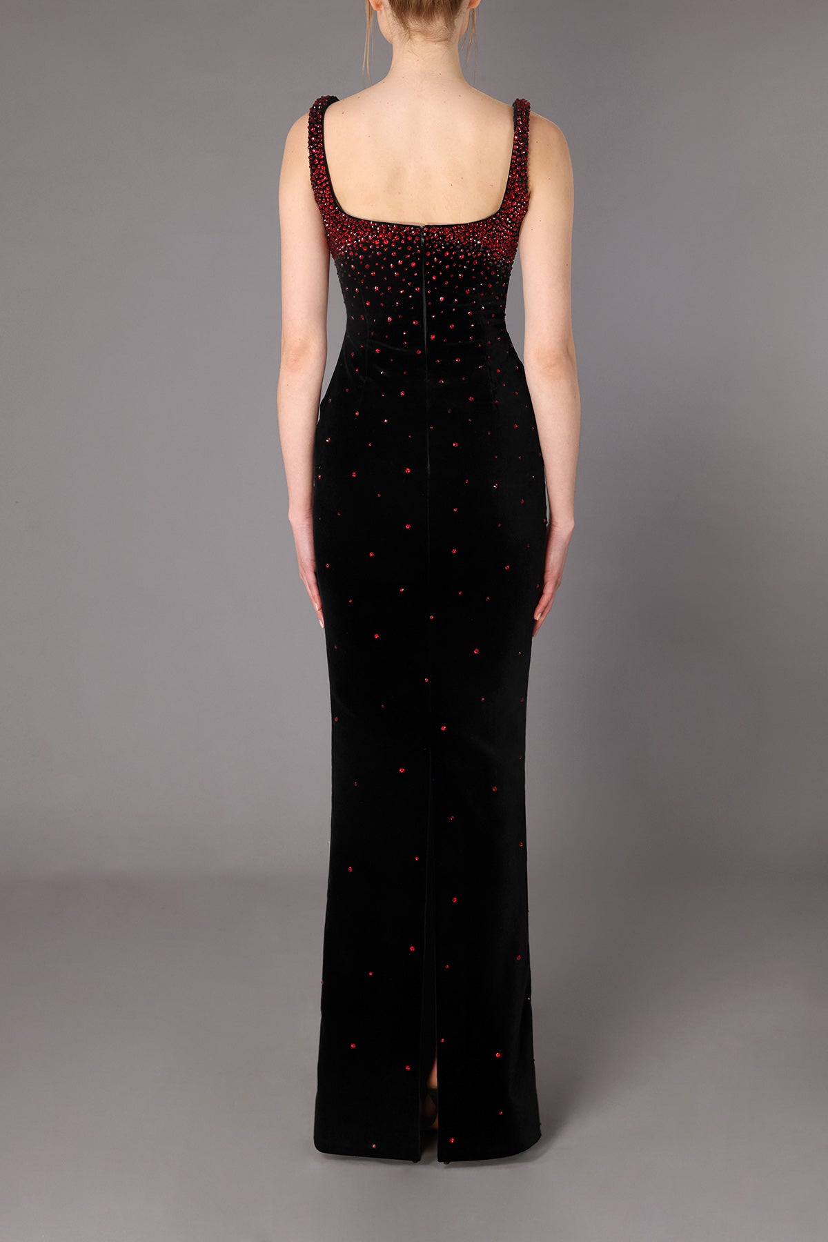 Fitted black velvet dress with deep red stones
