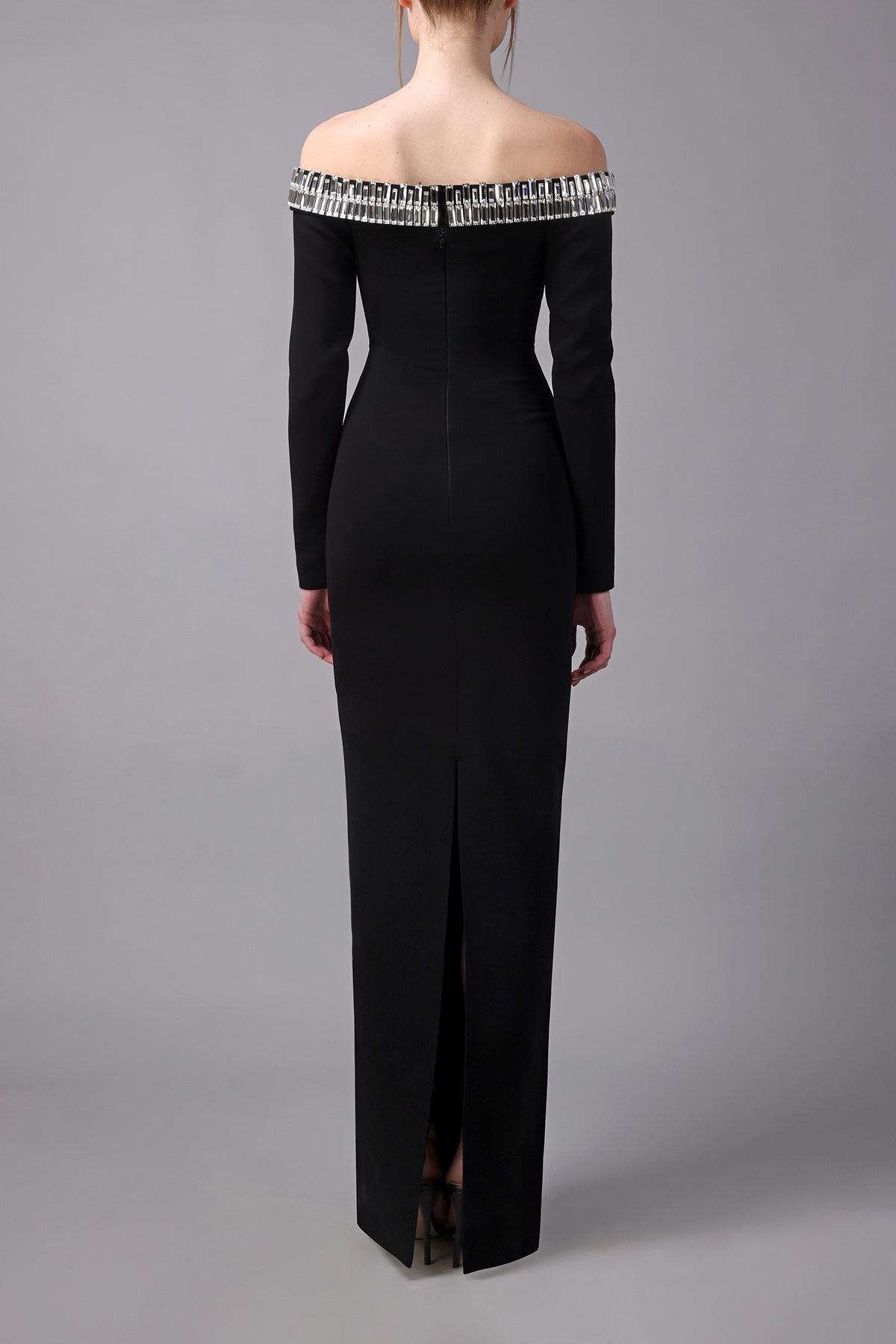 Fitted strapless black dress with crystal baguettes neckline