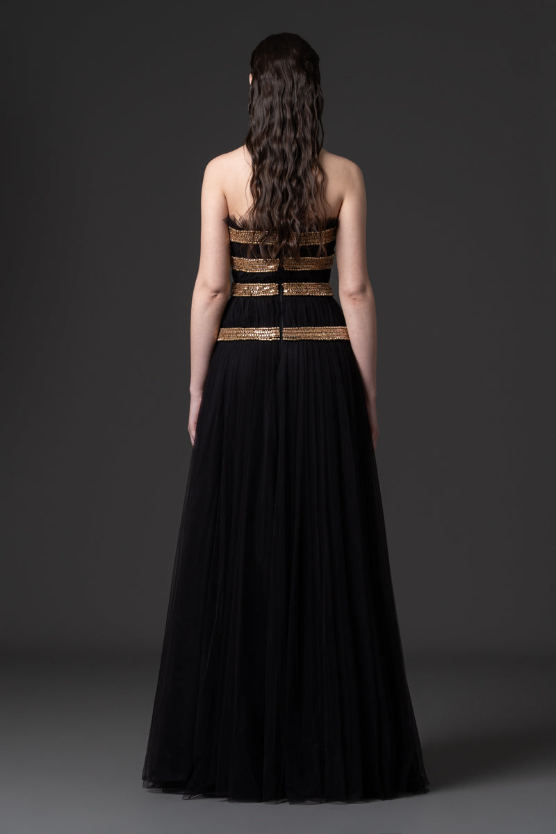 A strapless tulle gown beaded with metallic stones