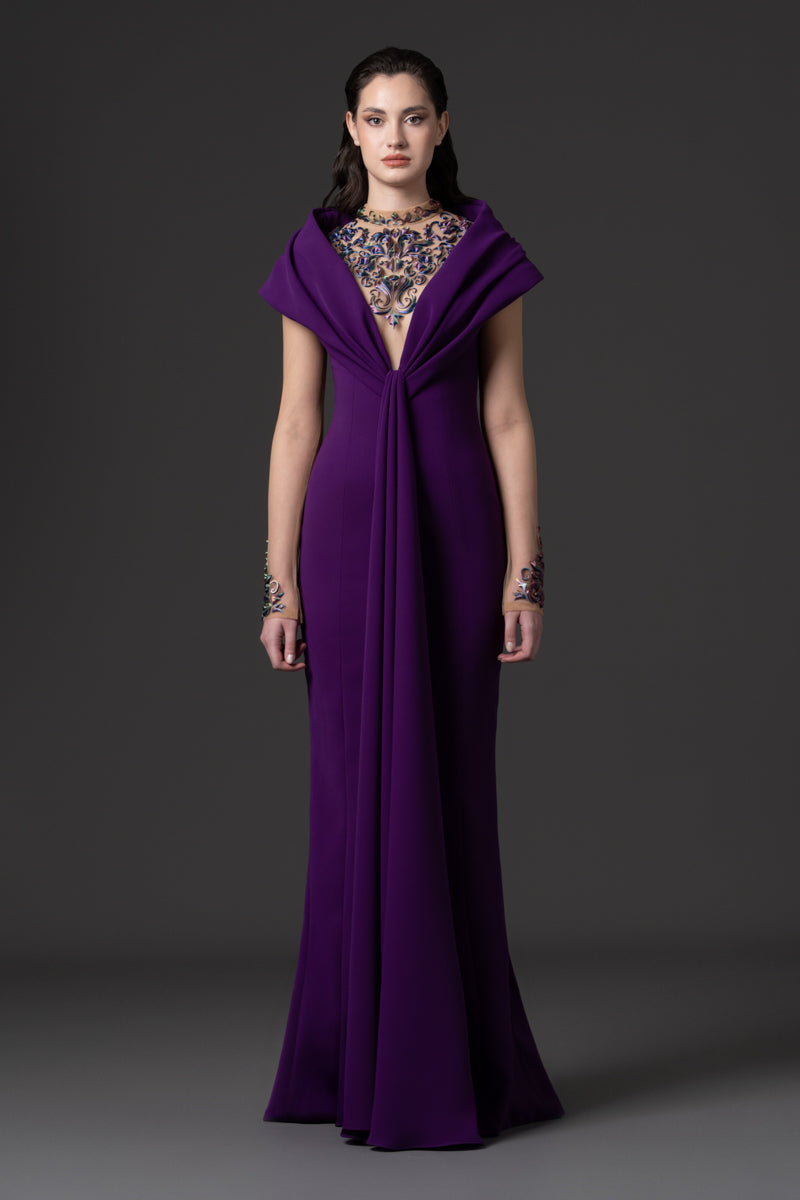 A crêpe dress with an off-the-shoulder neckline and a 3D-printed embroidery
on the bodice and sleeves