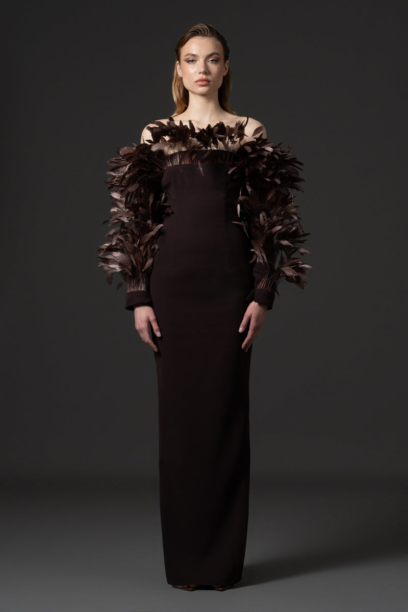 A crêpe gown with voluminous feathers on neckline and sleeves