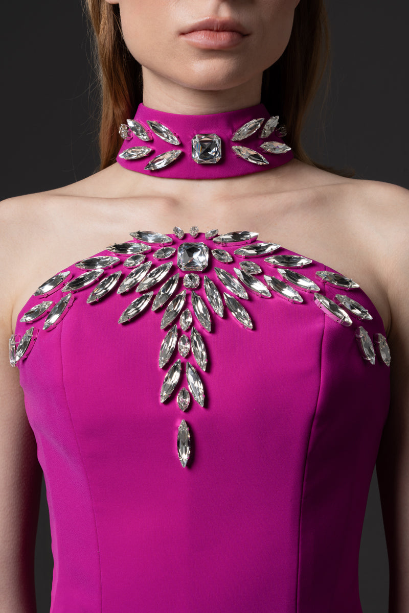 A fitted strapless crêpe gown embellished with crystal embroidery on choker and bust