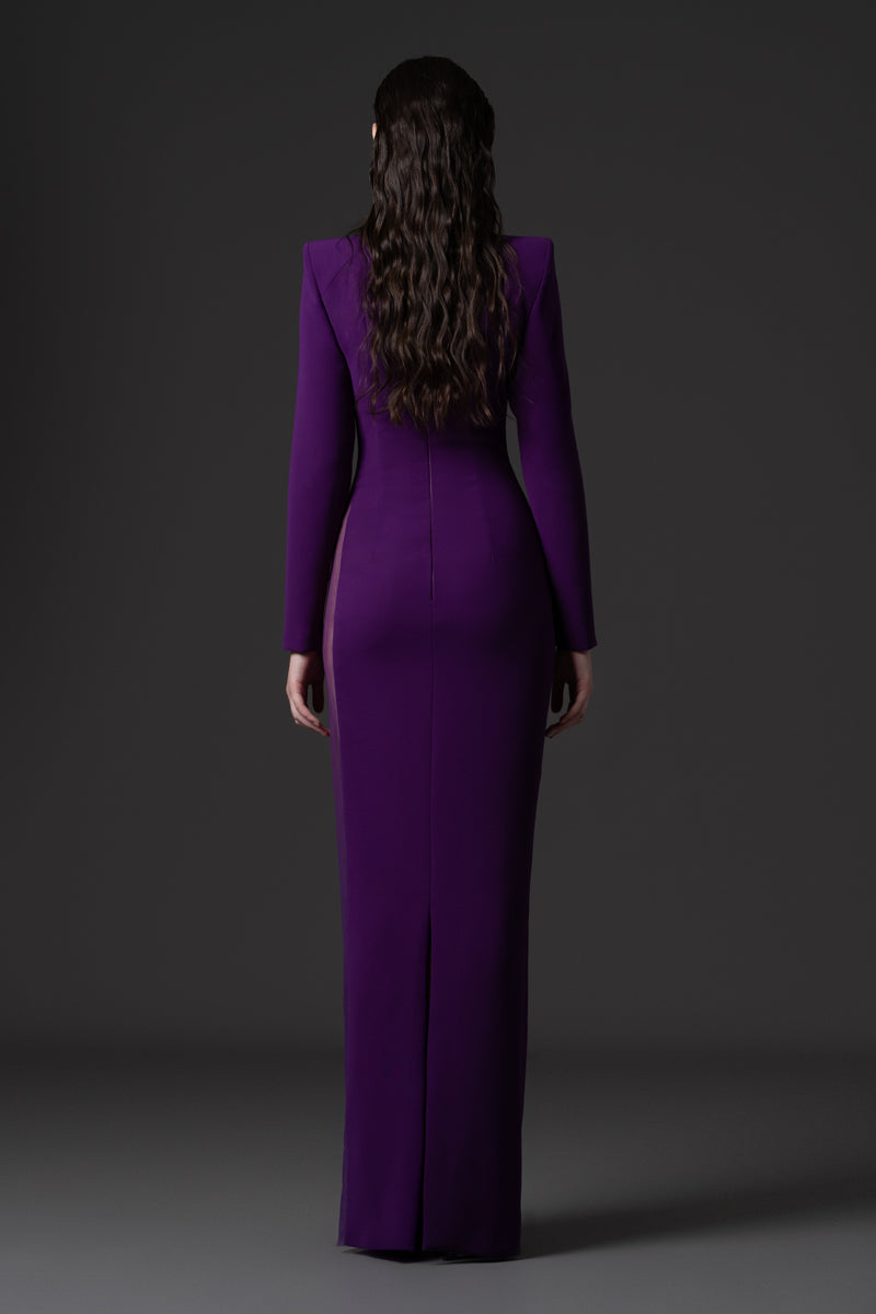 A high-neck fitted crêpe dress with long sleeves ,tulle side panel and beadings on the borders