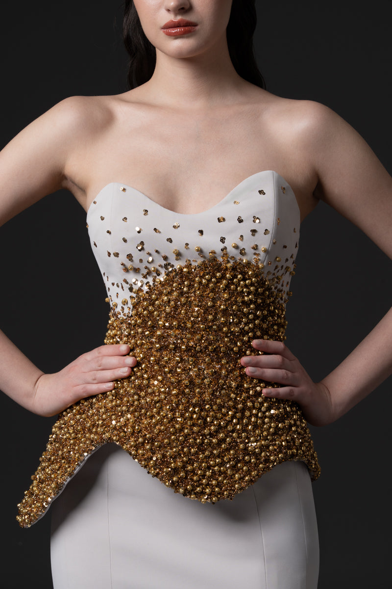 A mermaid dress with asymmetrical beaded corset