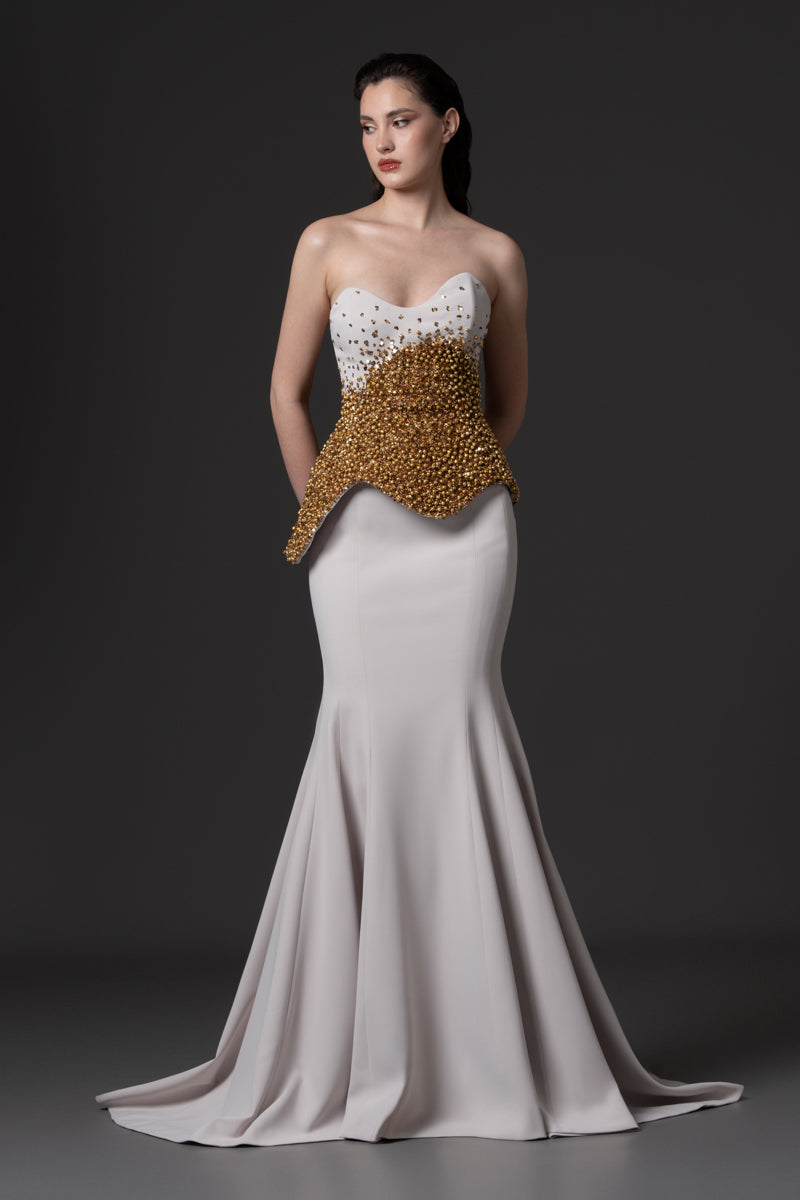 A mermaid dress with asymmetrical beaded corset
