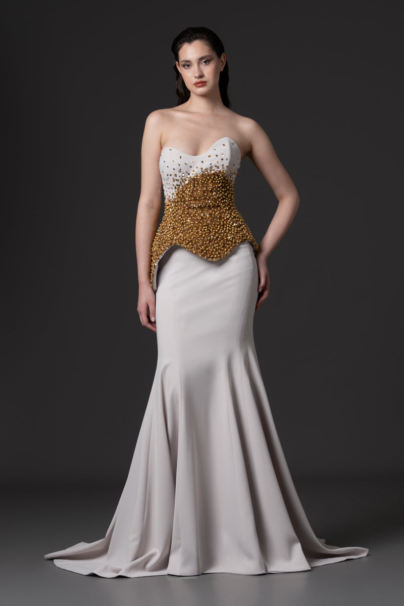 A mermaid dress with asymmetrical beaded corset