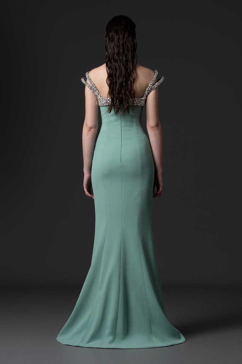 A mermaid gown, featuring off-the-shoulder beaded straps