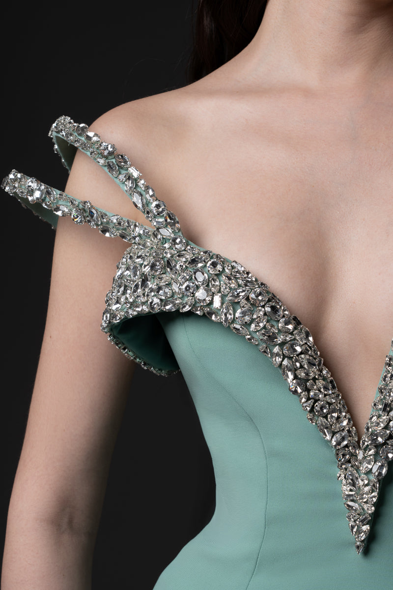 A mermaid gown, featuring off-the-shoulder beaded straps