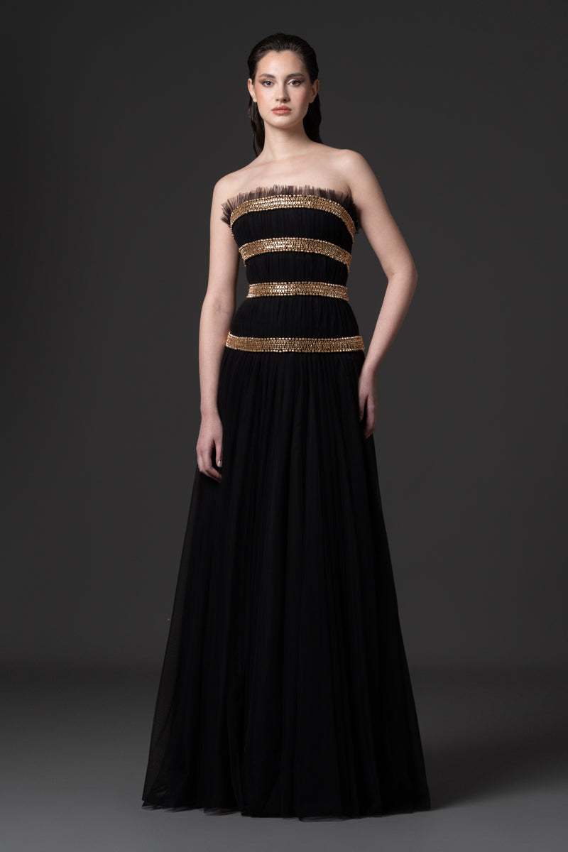 A strapless tulle gown beaded with metallic stones