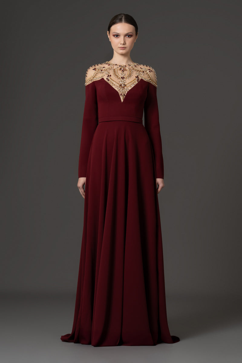 A-line gown featuring a sheer illusion neckline embellished with cryst A-line gown featuring a sheer illusion neckline embellished with cryst