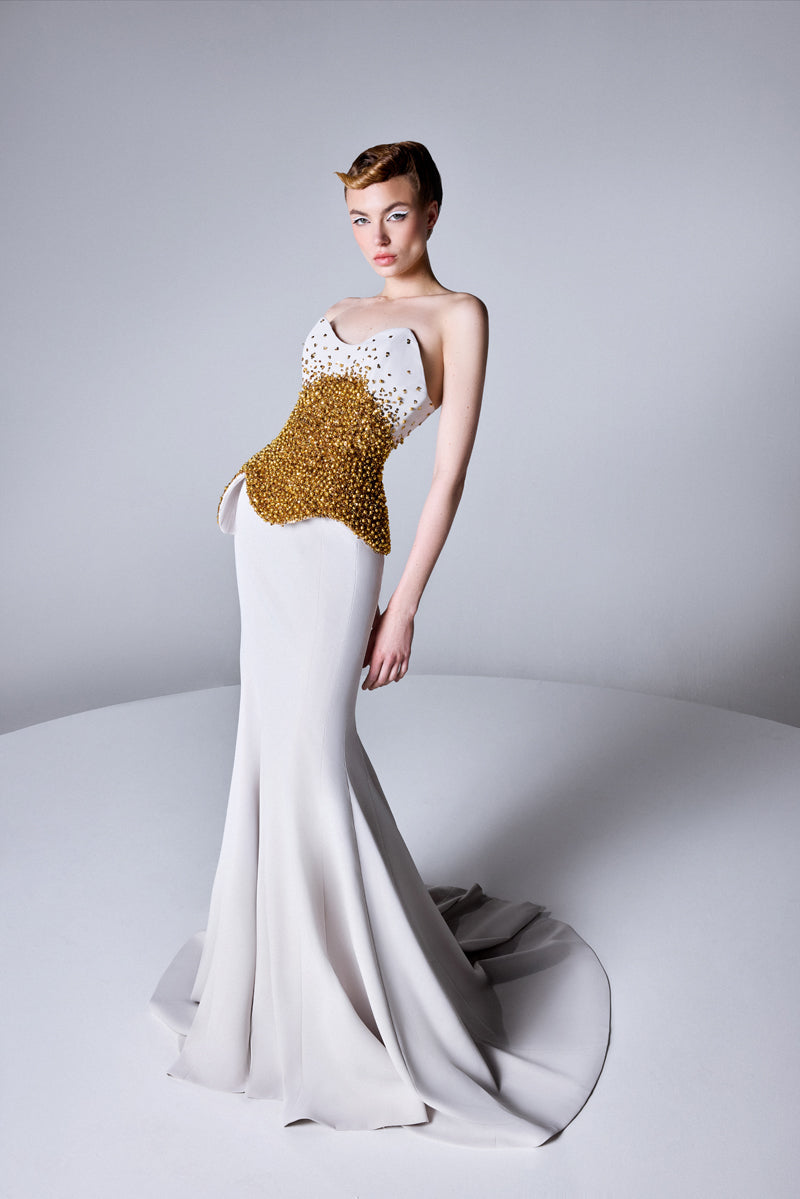 A mermaid dress with asymmetrical beaded corset