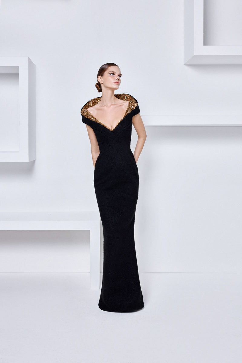 A boucl gown with a V neckline and a structured beaded collar A boucl gown with a V neckline and a structured beaded collar