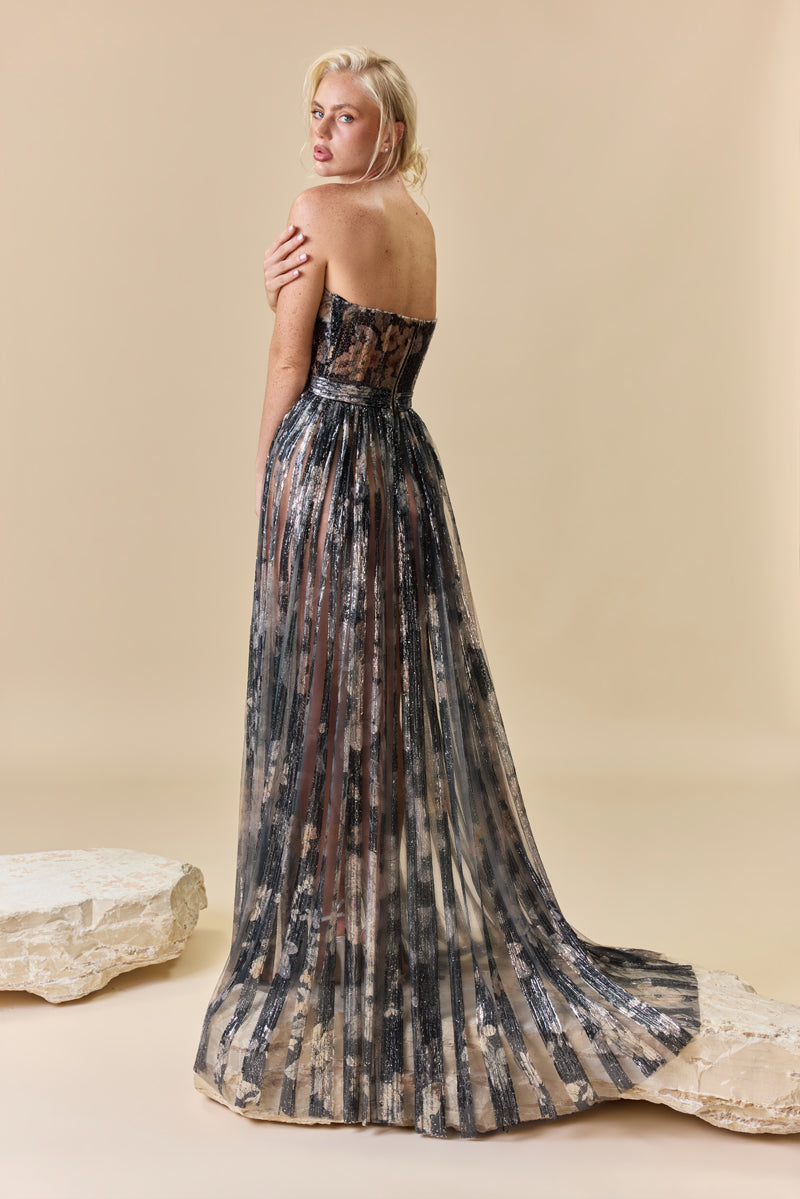 A strapless printed sequins A-line dress with a flowing cape.