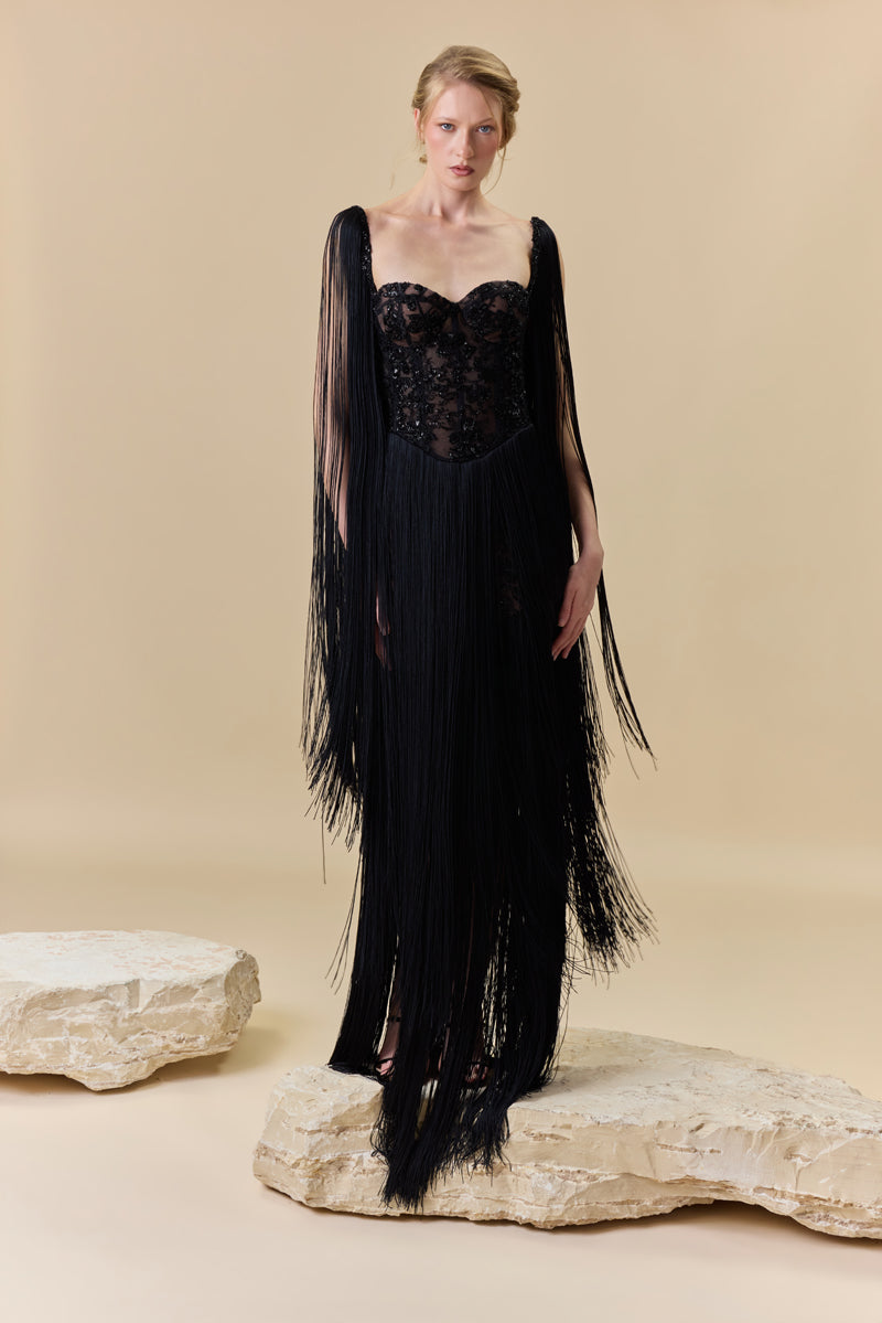 A heart shape fully beaded corset with silk fringes on the skirt and shoulders.