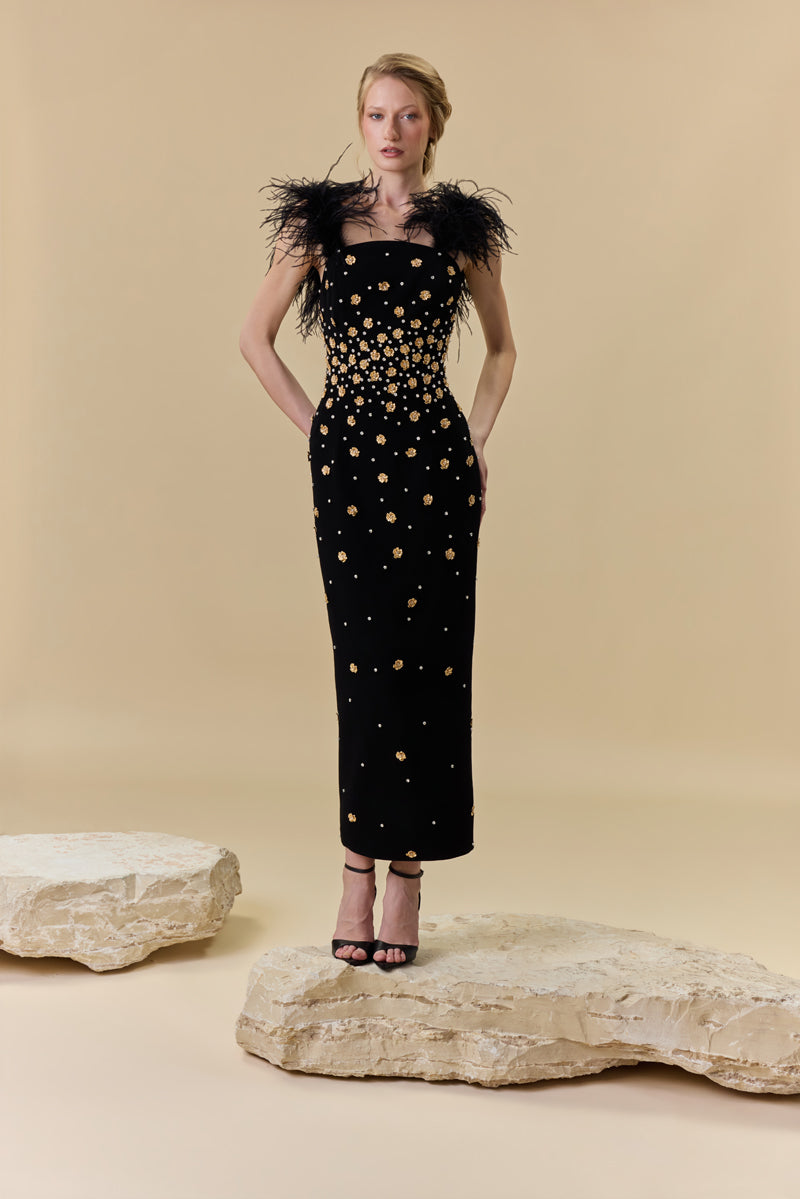 A crêpe fitted midi dress embellished with metallic flowers , stones and feathers on the shoulders.