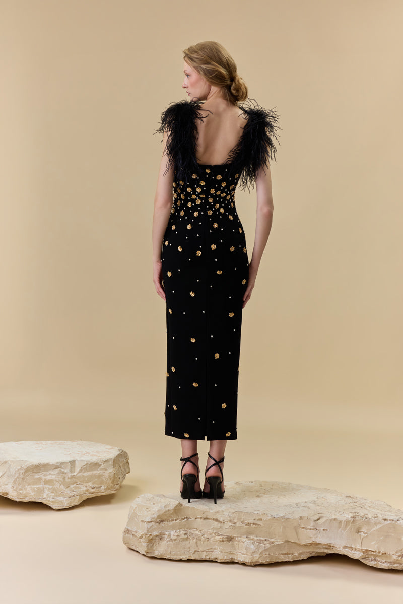A crêpe fitted midi dress embellished with metallic flowers , stones and feathers on the shoulders.
