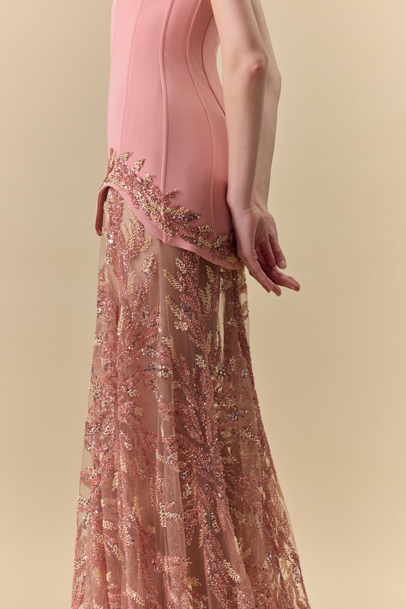 A two-piece ensemble featuring a crepe strapless short dress and a floor-length A-line tulle fully beaded skirt.