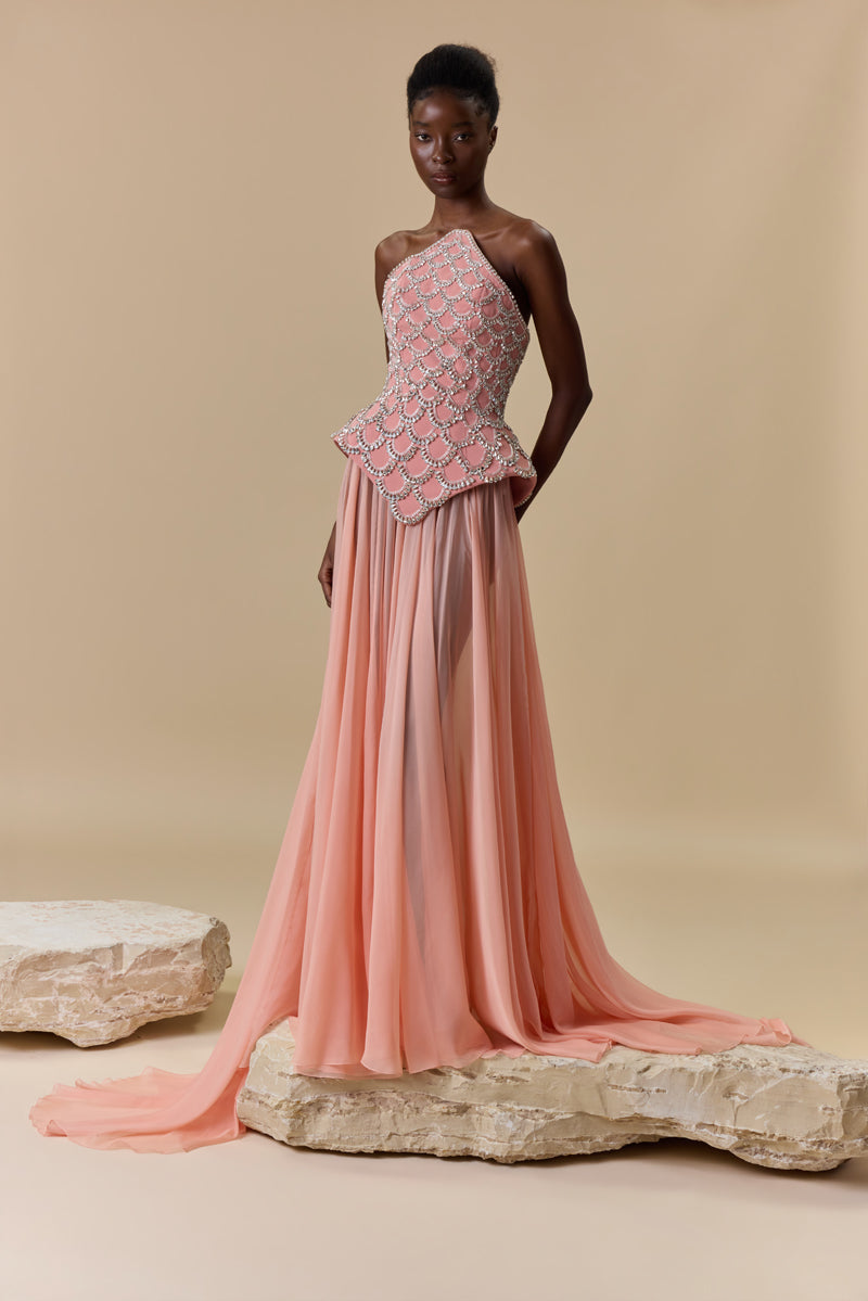 A crêpe corset beaded with crystals and paired with a flowing chiffon A-line skirt.