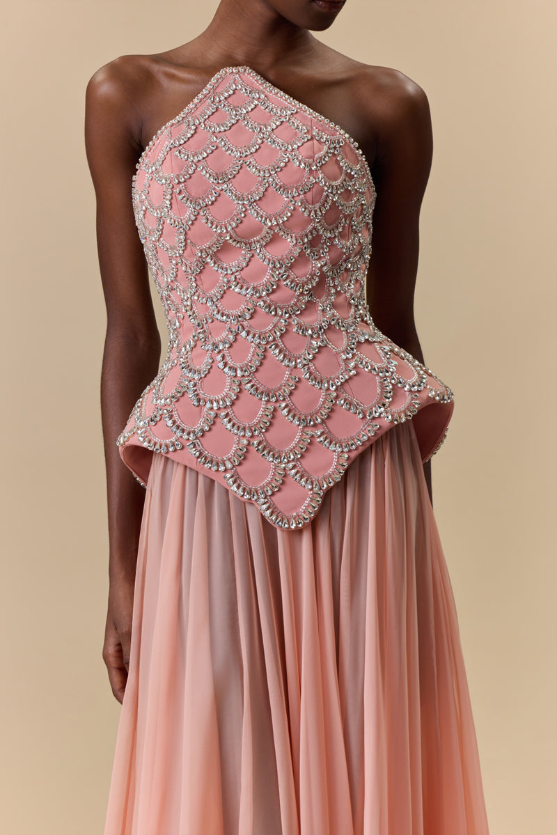 A crêpe corset beaded with crystals and paired with a flowing chiffon A-line skirt.