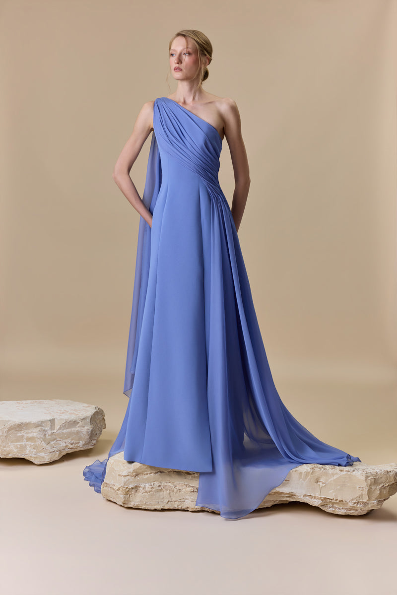 An asymmetrical one shoulder crepe dress with chiffon drapings.