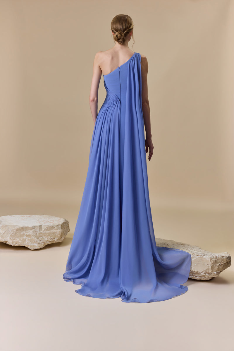 An asymmetrical one shoulder crepe dress with chiffon drapings.