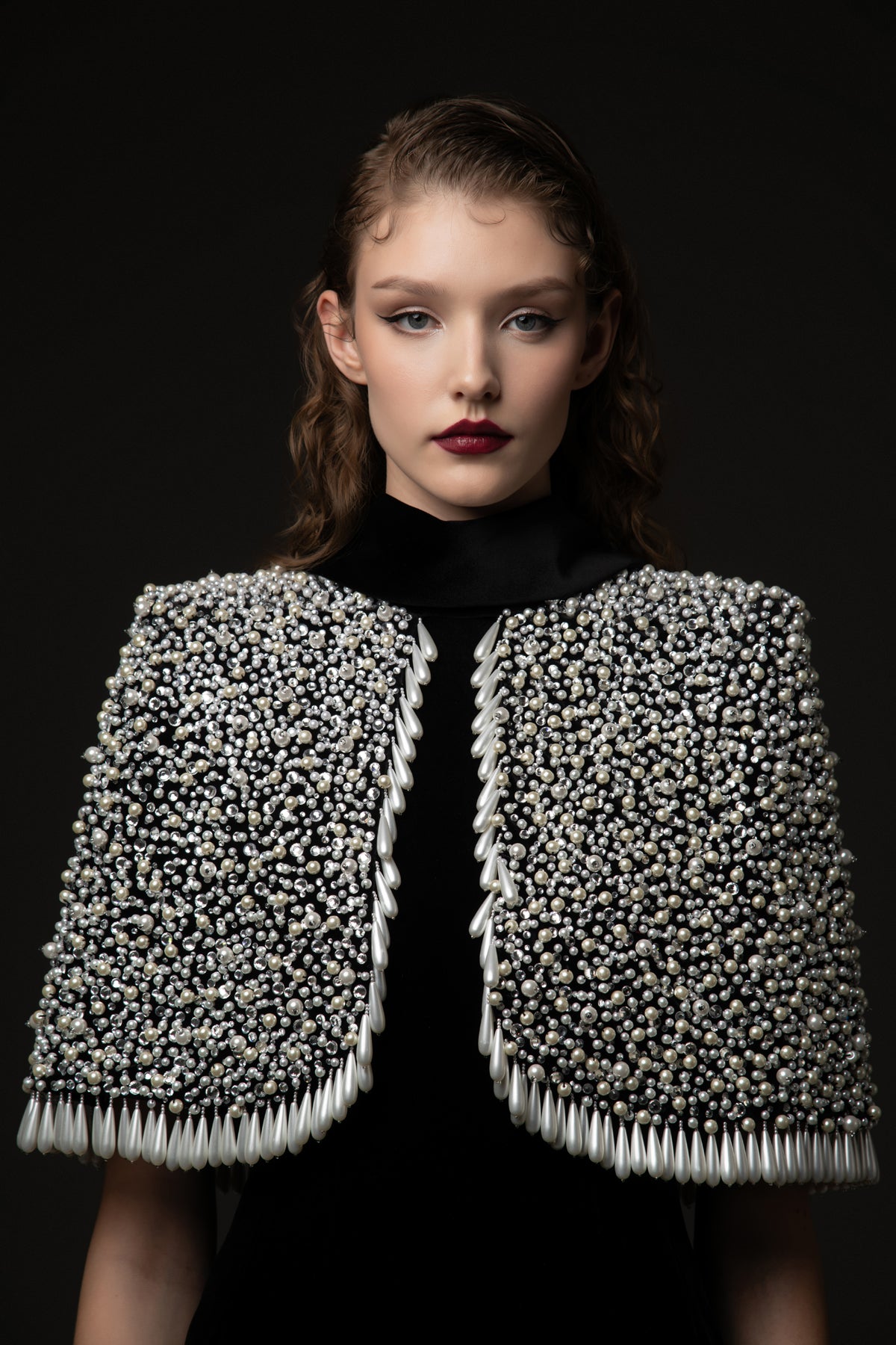 Black velvet dress paired with a fully embroidered bolero