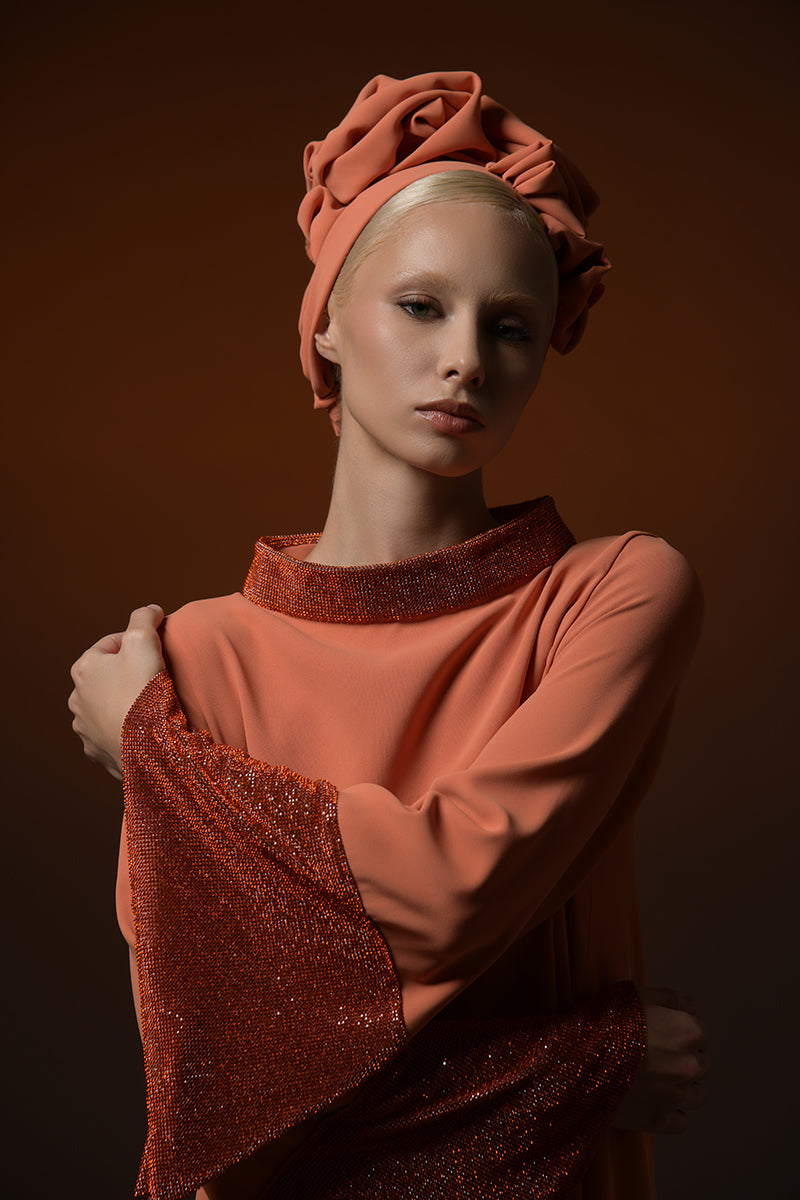 Orange crêpe abaya with crystal embellished chainmail along the neckline and sleeves