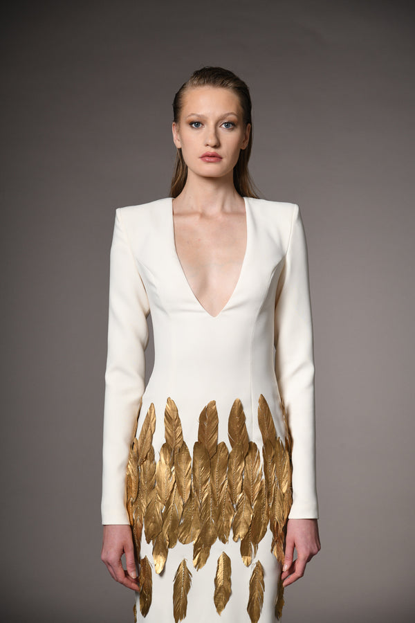 Ivory white long sleeved dress with gold feathers
