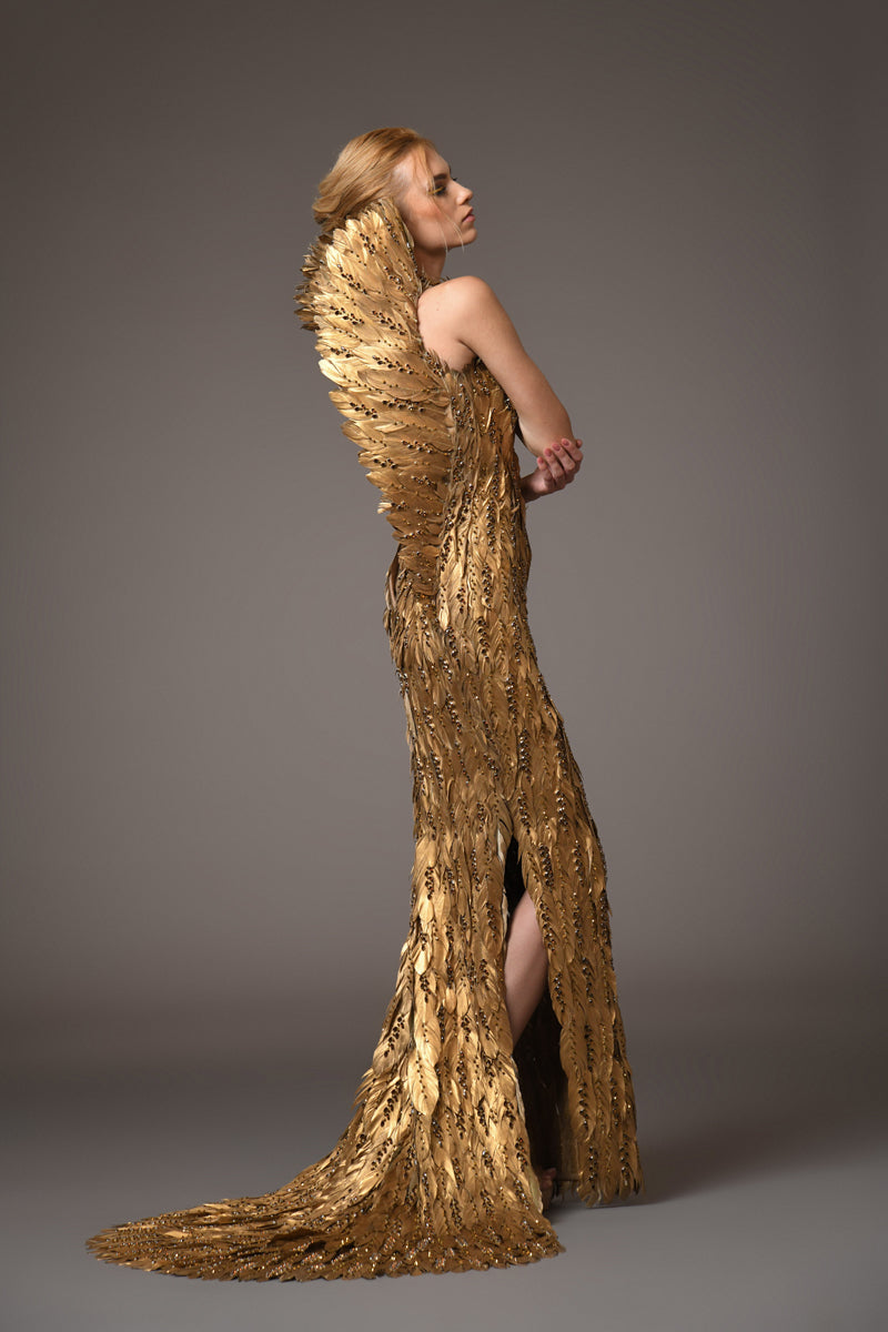 Golden feather gown with embroidery on feathers and a winged standing collar with train in back