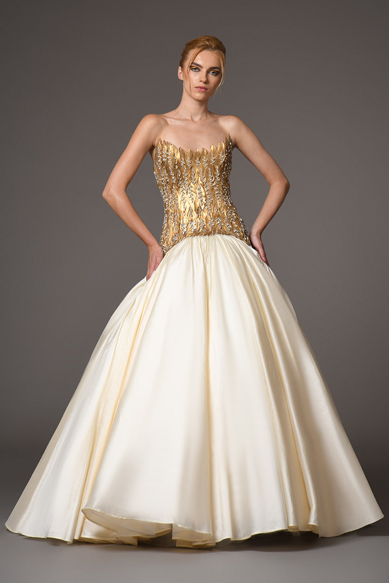 A golden feather corseted dress