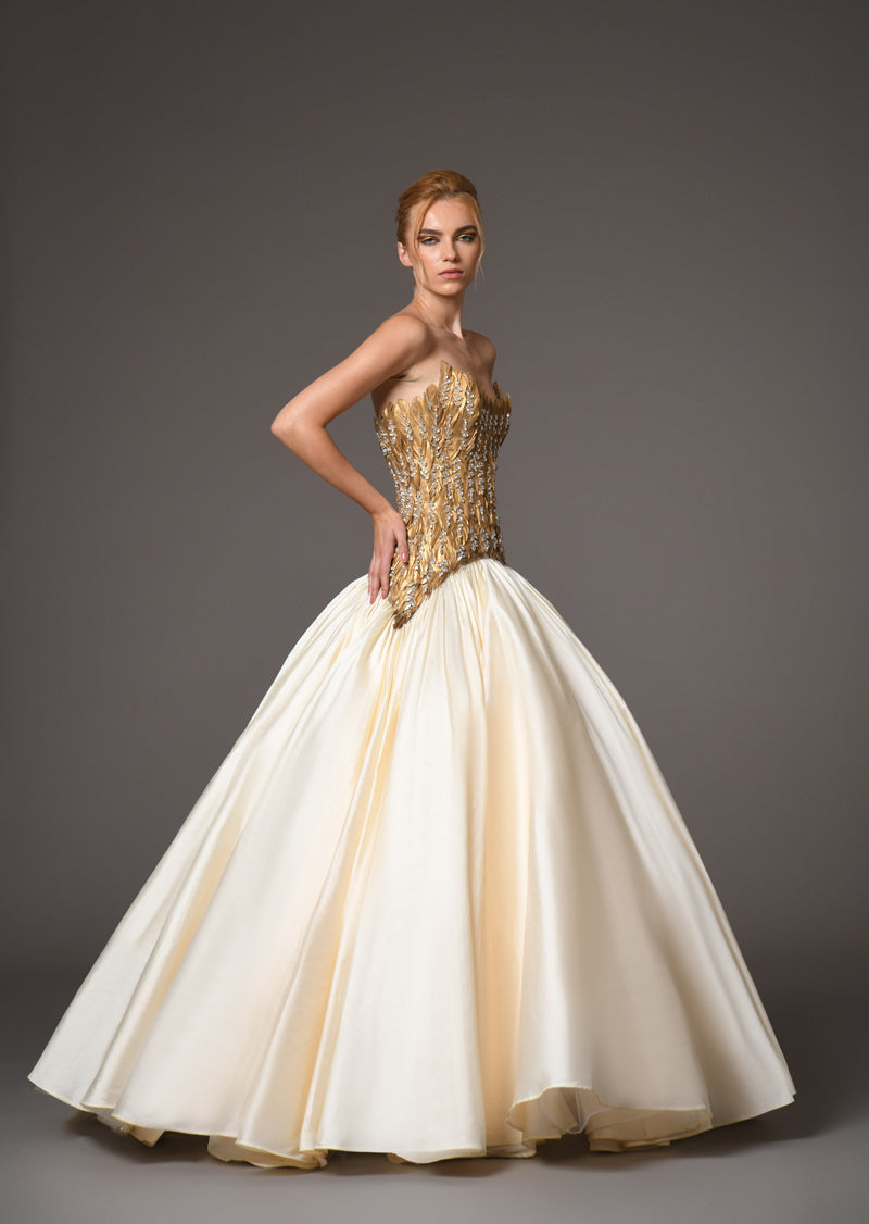 Golden feather corset with voluminous taffeta skirt side