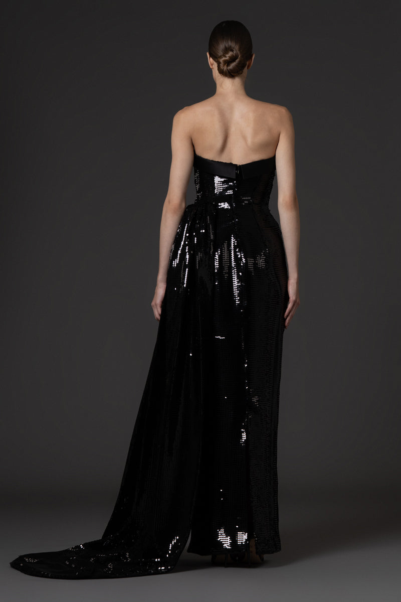 Strapless black sequin dress , featuring a one sided overskirt and a satin bustline