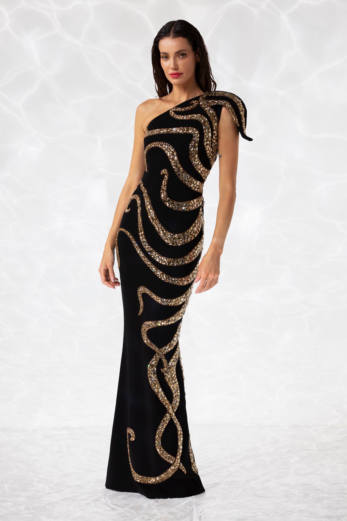 Black crpe column gown, lavishly illustrated with an octopus embroide Black crpe column gown, lavishly illustrated with an octopus embroide