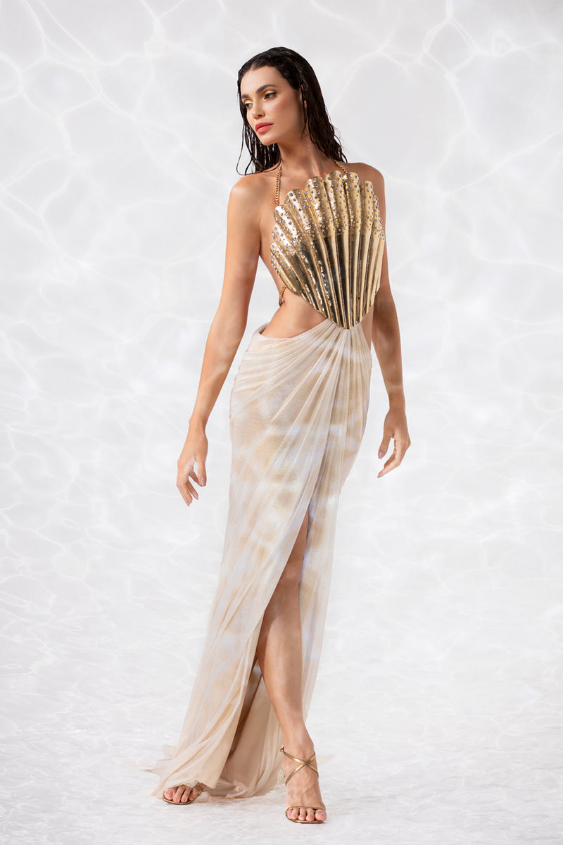 Backless gold-plated scallop shell corset handcrafted from solid brass and studded with crystals, worn with a draped skirt in gold foiled silk tulle