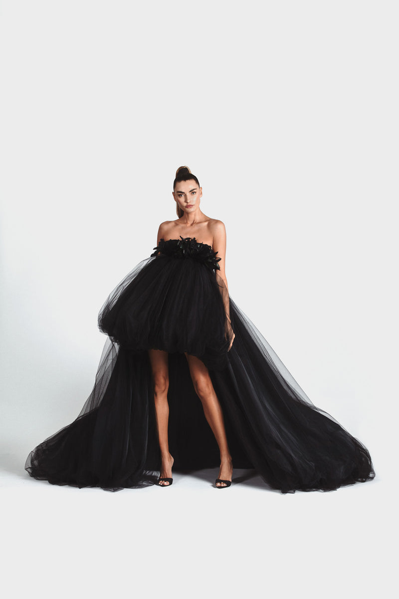 Sleeveless puffball gown in black tulle and rainbow reflective taffeta with a black velvet corset embellished with coq plumes