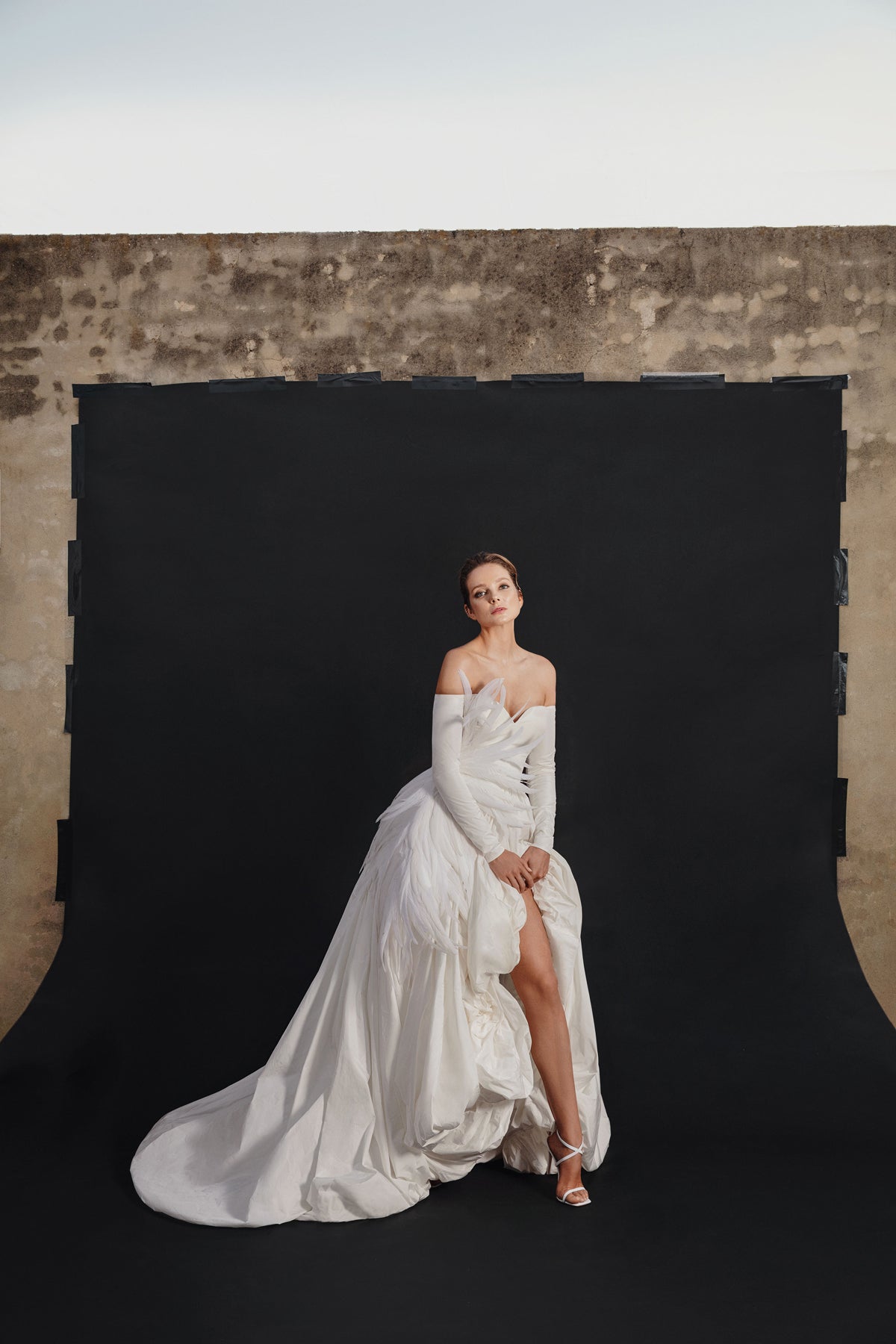 Ivory silk taffeta puffball gown with feathers