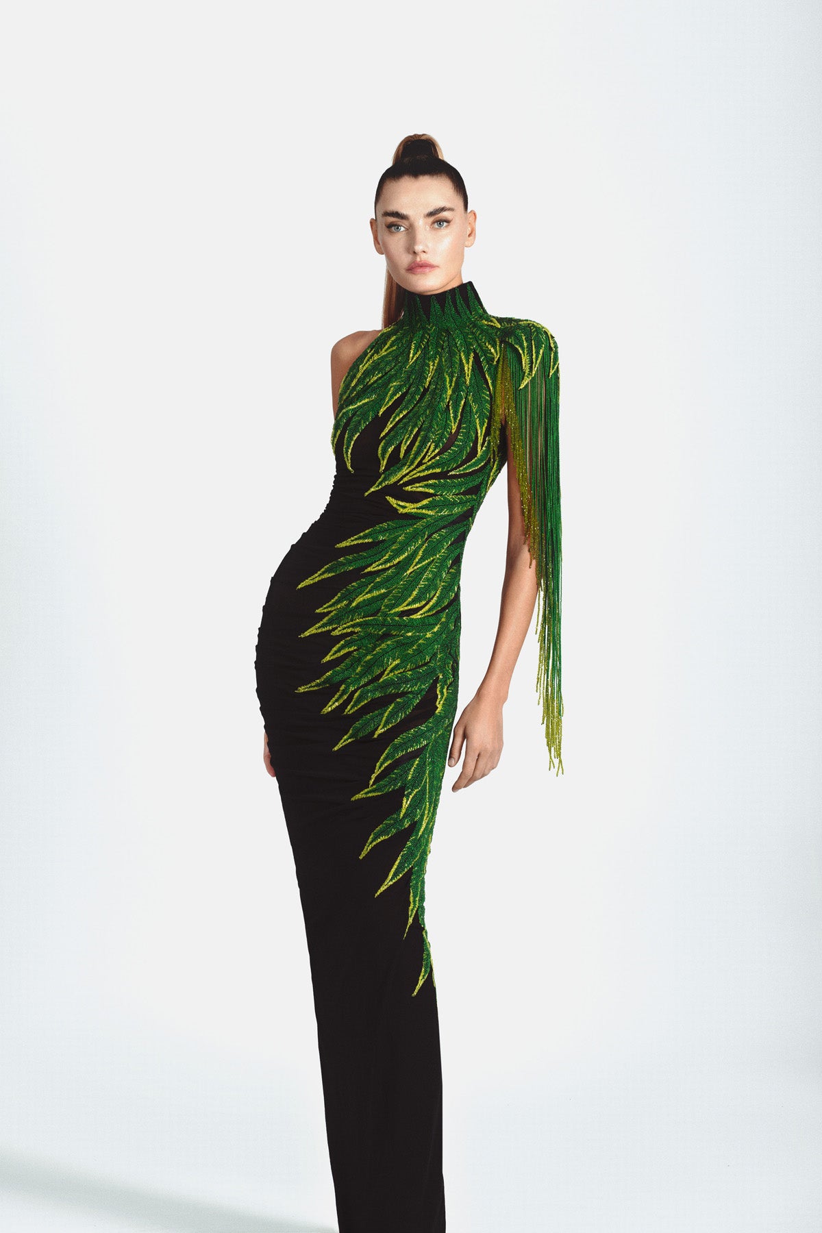 Graphic dress in black silk jersey featuring embroidered leaves in glass beads, bugle beads, crystals and hanging beaded fringes