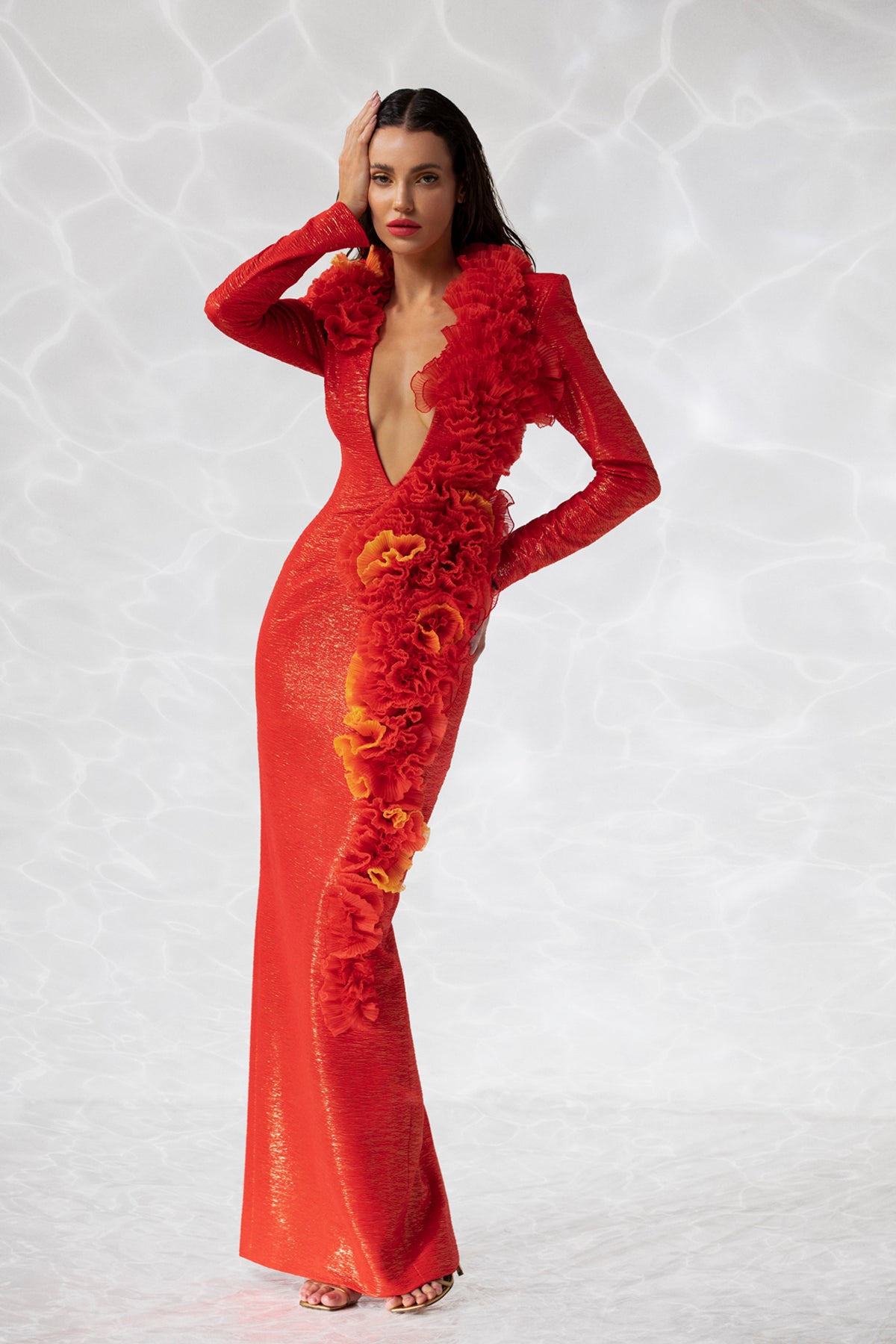 Long sleeved column dress in sunset orange lamé with silk organza plissé ruffles