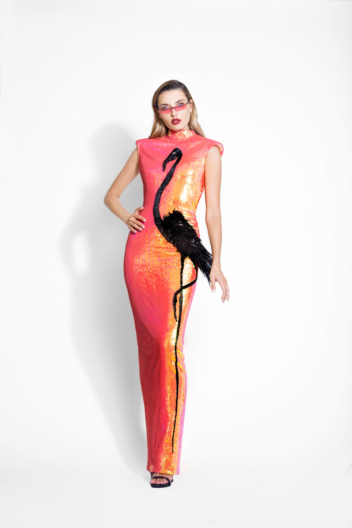 Structured high-necked iridescent sequin dress lavishly illustrated with a black flamingo in 3D plumes, silk and raffia threadwork, crystals and macro sequins