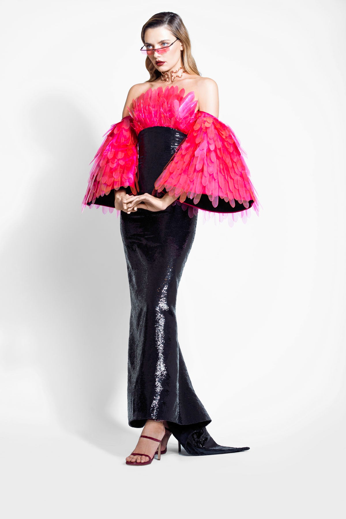 Structured jet black sequin dress featuring structured sleeves and a bustier embellished with layered 3D handcrafted plumes