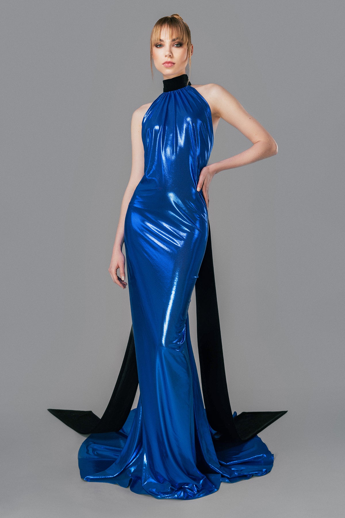 High necked blue lamé dress with black velvet tie