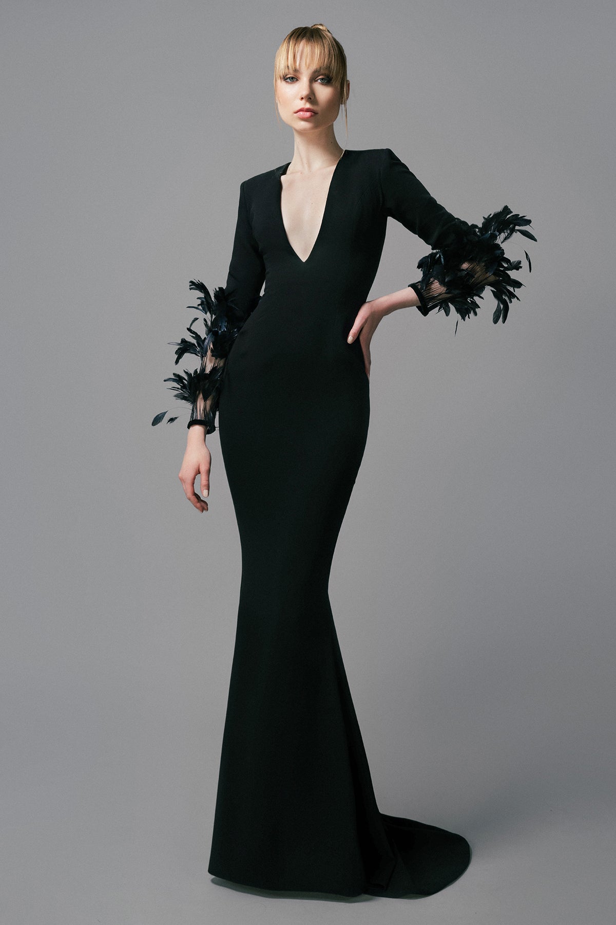 Black crpe dress with feathers on the sleeves Black crpe dress with feathers on the sleeves