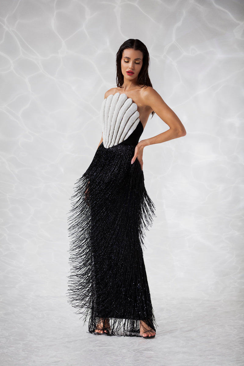 Sleeveless scallop shell inspired dress consisting of a bustier embroidered with crystals and glass beads, a skirt in hanging beaded fringes