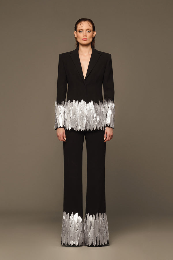 Structured black suit with silver painted feathers