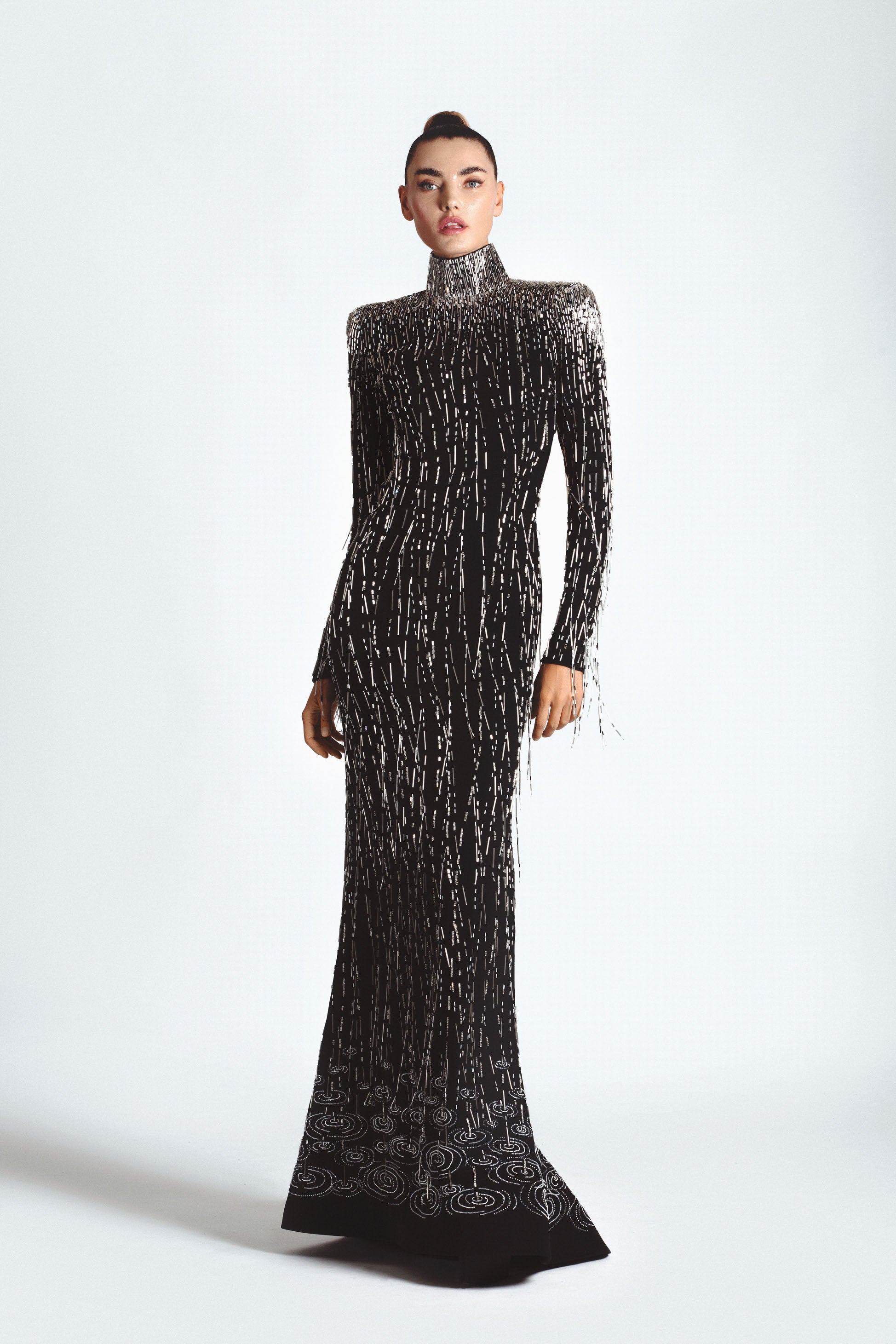 Structured black silk crêpe dress embroidered with bugle beads, crystal baguettes and hanging beaded fringes finished with water ripples effect at the hemline